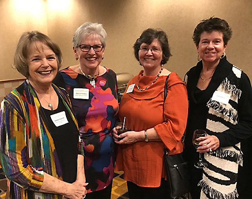 A group of four women posing for a picture at an Osher event. A group of four women posing for a picture at an Osher event.