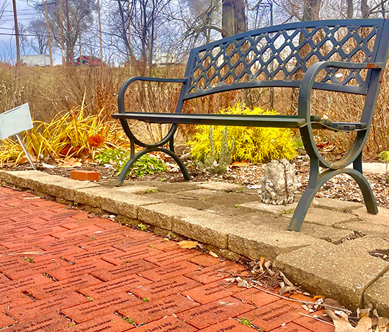 bench beside brock path